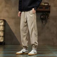 唐狮2026秋季新款休闲长裤男士束脚裤黑色时尚百搭松紧腰宽松男裤